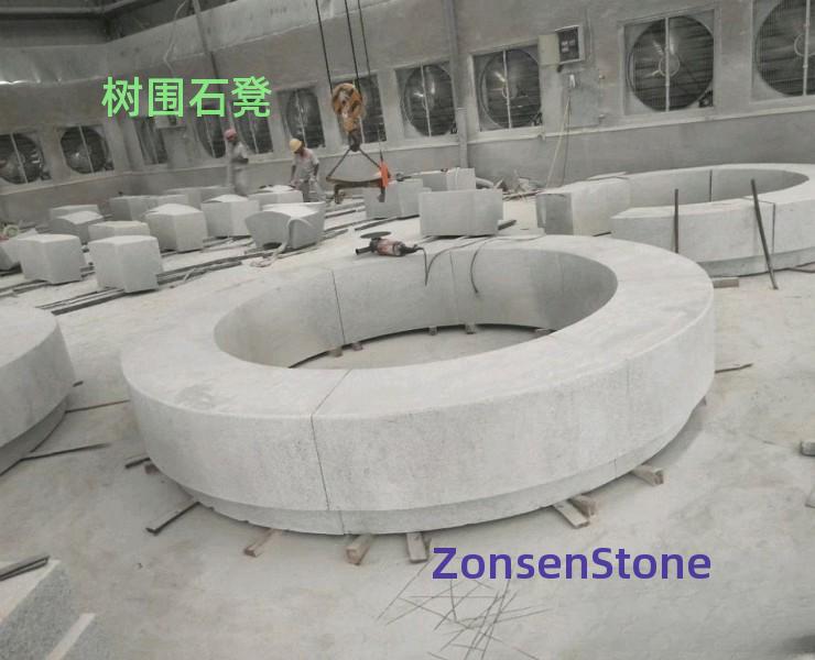 Tree surrounding stone bench