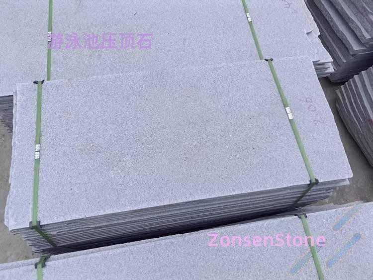 Swimming pool capping stone