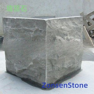 Stone at the top of the wall