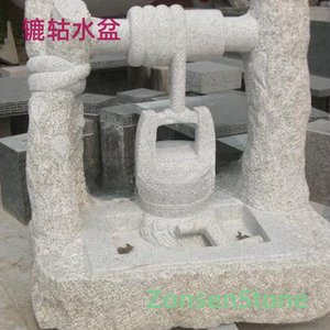 Water basin with a water wheel